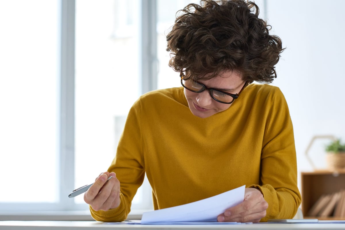 A new business owner reviewing commercial lease paperwork with the support of a new business lease solicitor