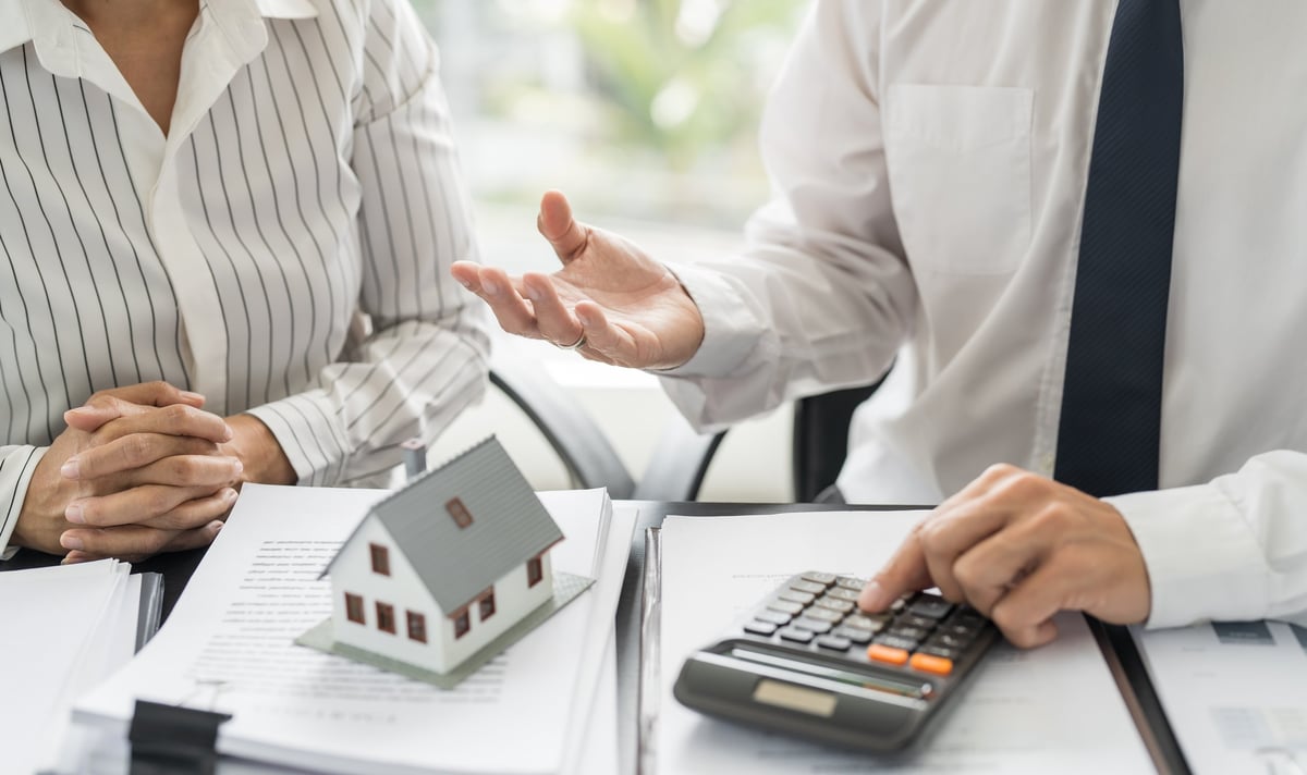 Commercial landlord signing heads of terms documents for a commercial lease with a solicitor