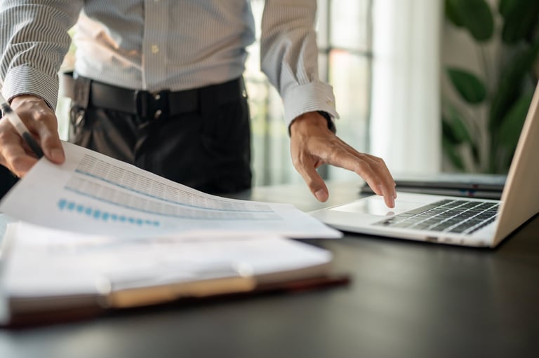 Commercial lease solicitors for accountants reviewing financial and lease documents at modern office desk