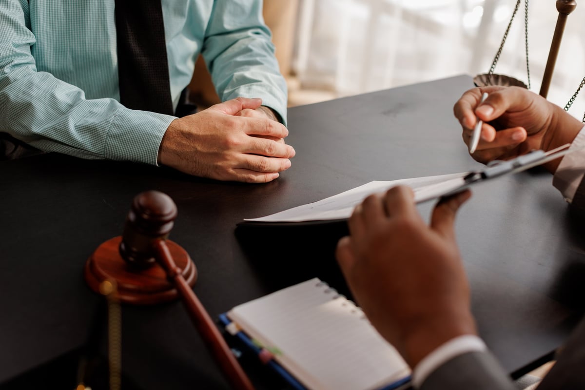 Commercial solicitor meeting with business client to discuss commercial property lease agreements
