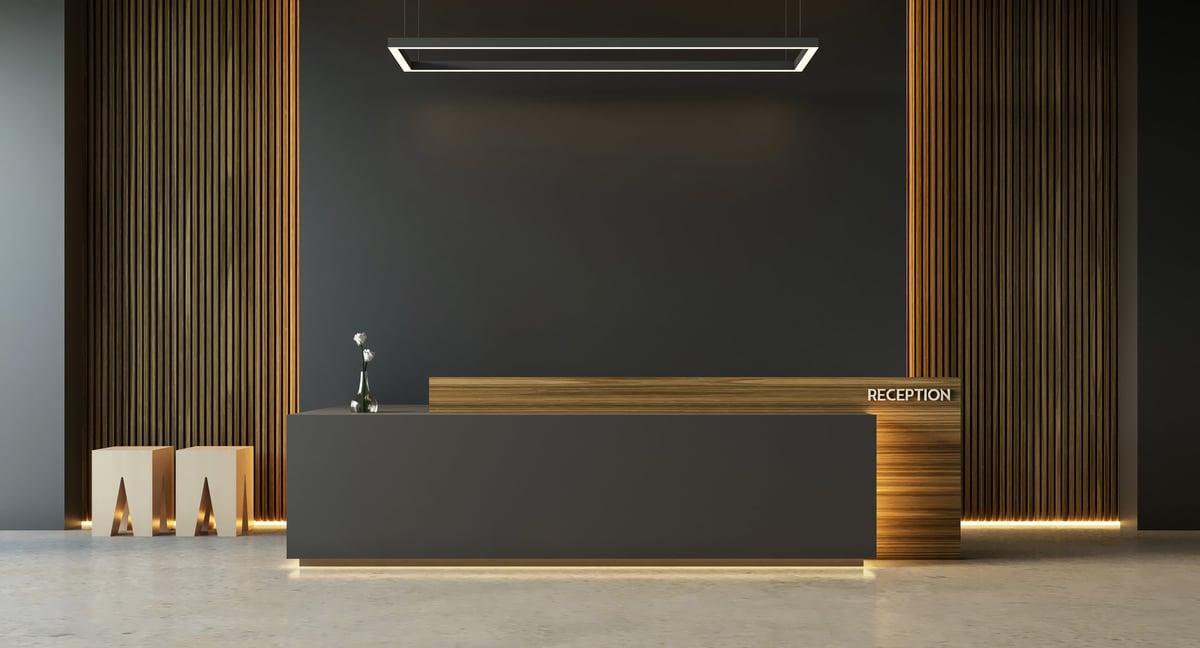 Modern hotel reception desk interior with elegant lighting — specialist lease solicitors for hotels advise on commercial property leases for hotel operators across England and Wales