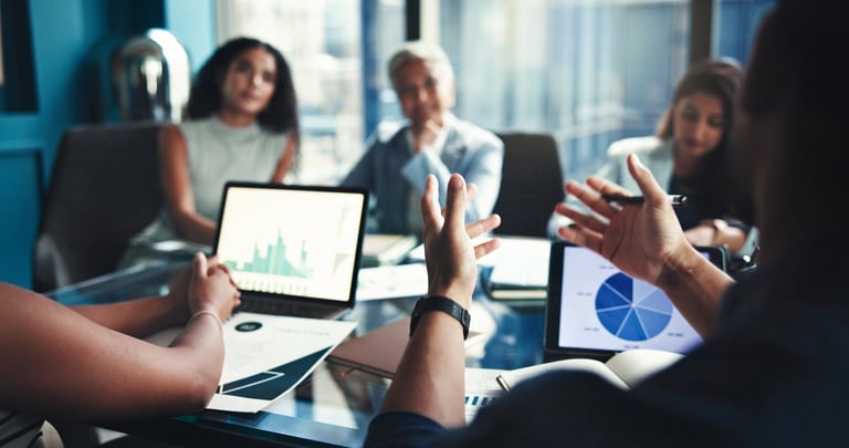 Commercial lease solicitors for estate agents reviewing lease documents at boardroom table