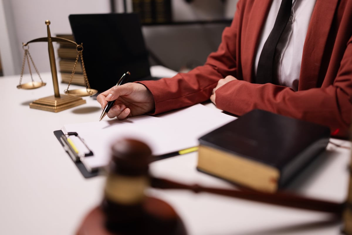 Commercial lease solicitor reviewing a commercial property lease agreement in a modern office