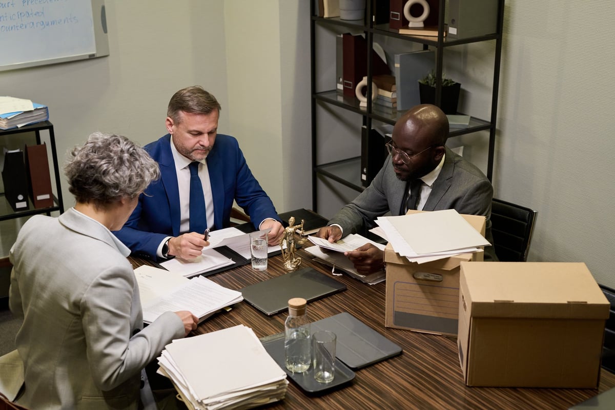 Senior solicitor reviewing commercial lease or licence to occupy agreement with business client