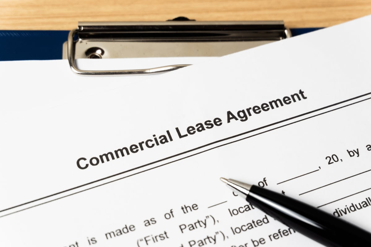 Commercial lease agreement document with pen, illustrating the 2026 rent review reforms