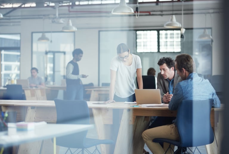 Commercial lease solicitors for IT and tech businesses reviewing lease documents with technology company founders