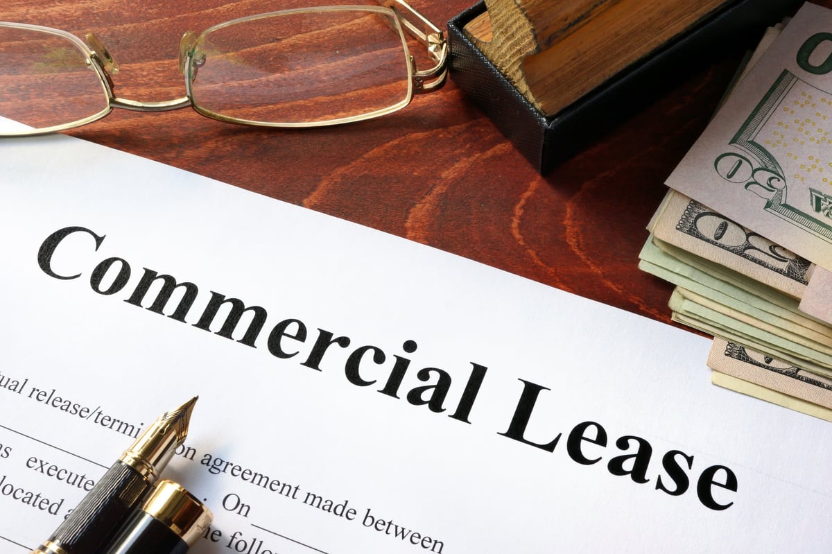 First commercial lease checklist with a business tenant reviewing a lease agreement and costs