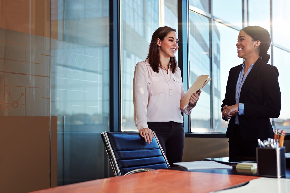 Two commercial lease solicitors consulting in a modern law office